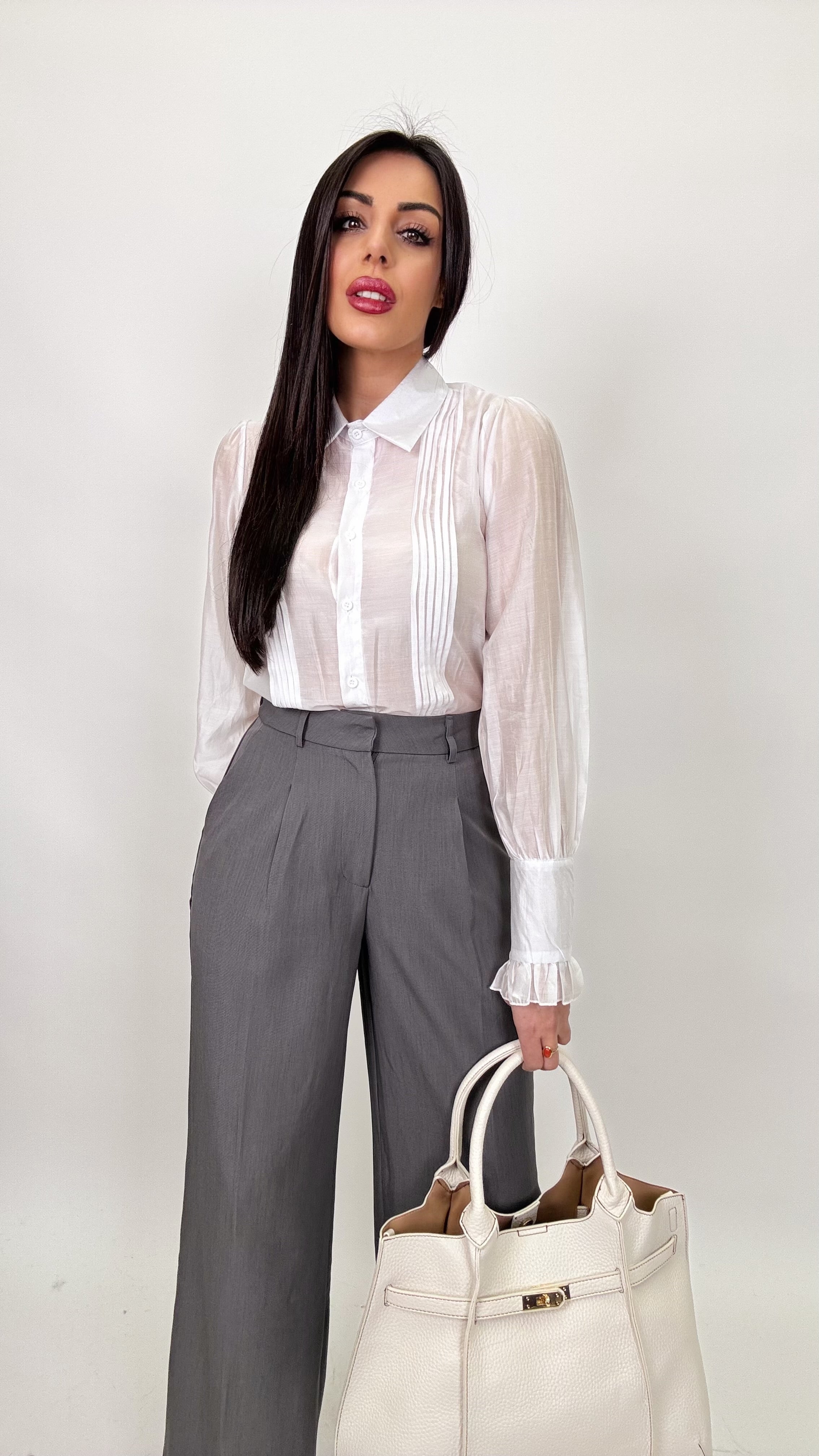 Pantaloni con piega sul fondo